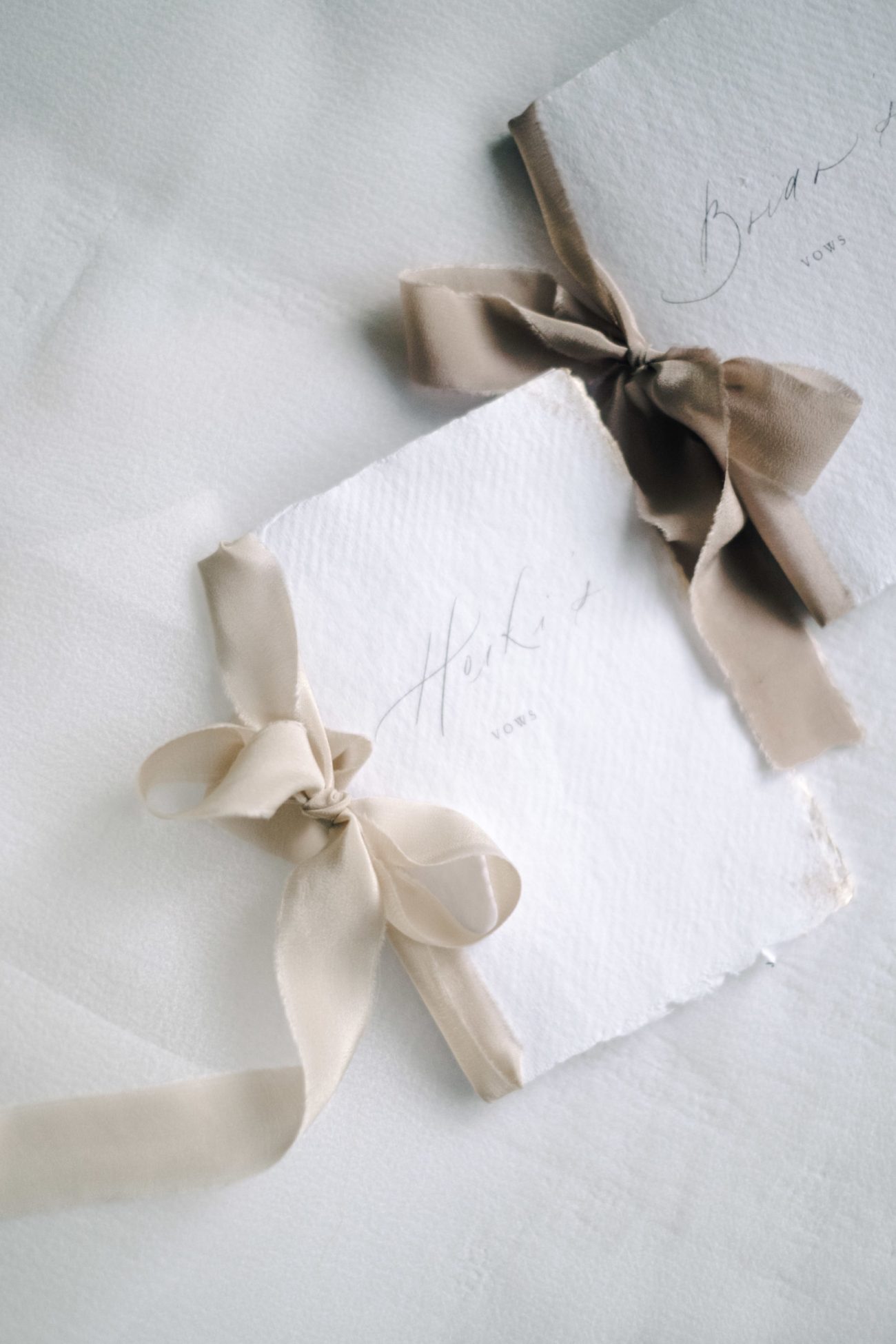 vow books with neutral beige silk ribbon