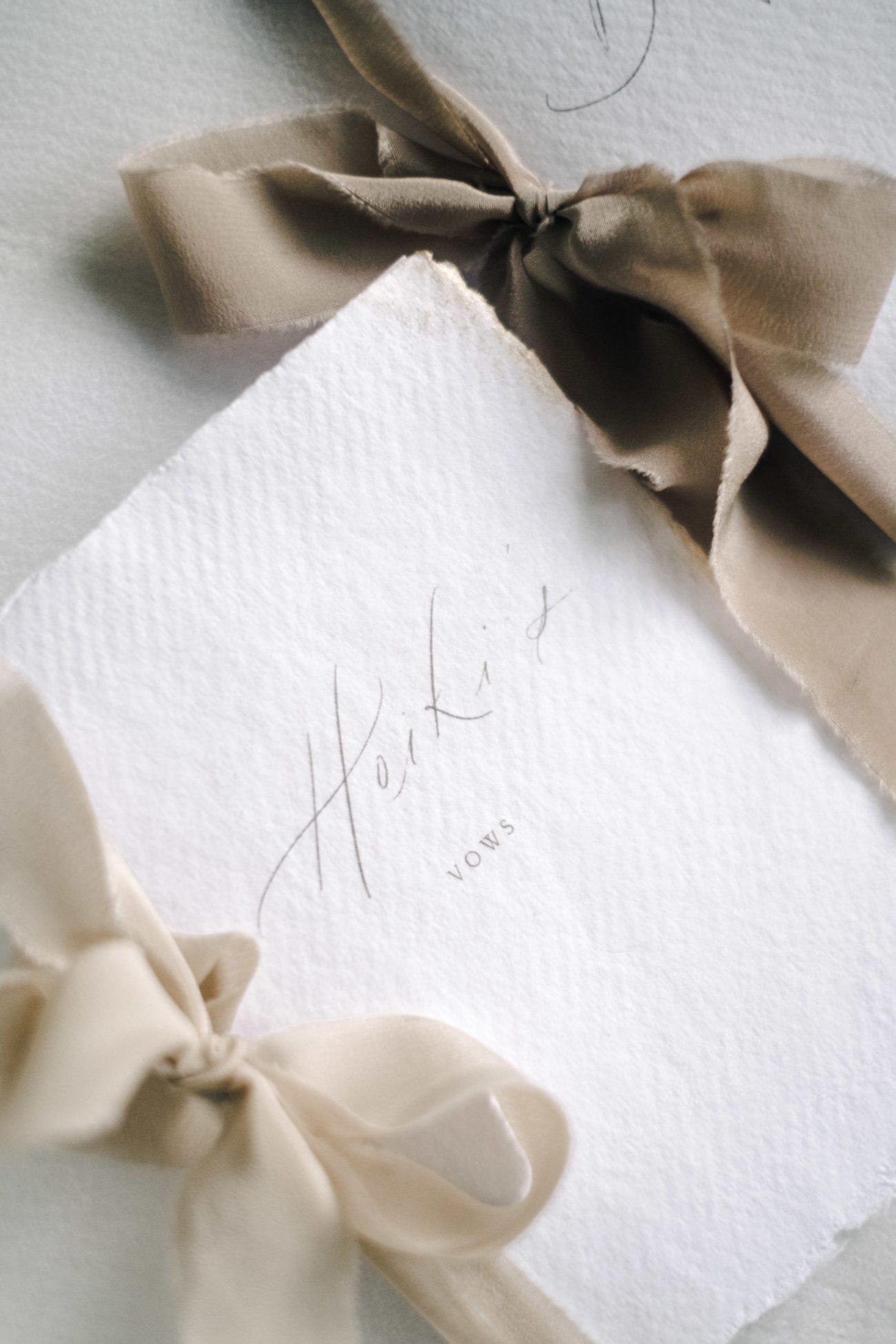 vow books with neutral beige silk ribbon